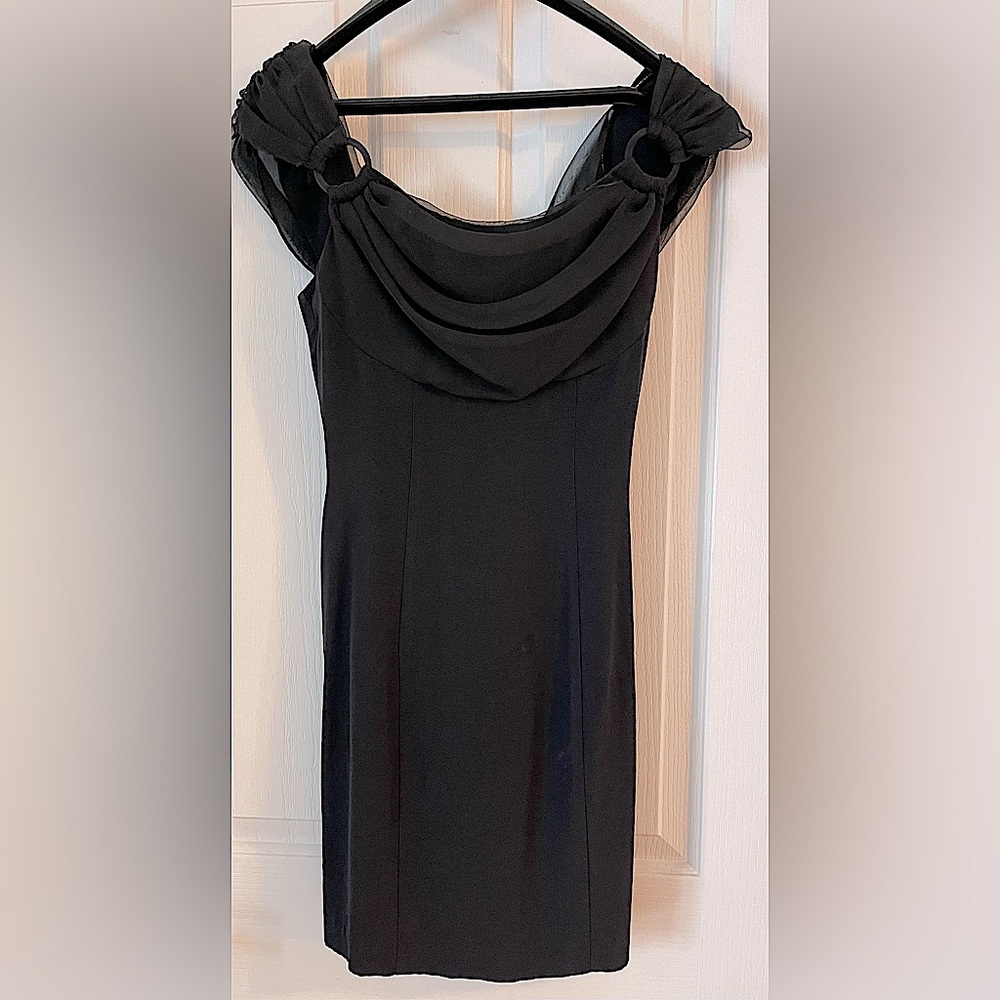 Black mini dress. Rampage 90’s label. Size Small.